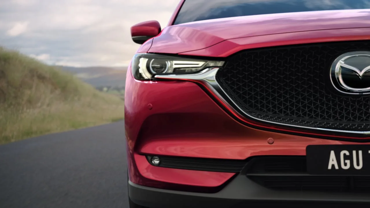 Mazda CX-5 commercial — the car on a coastal road
